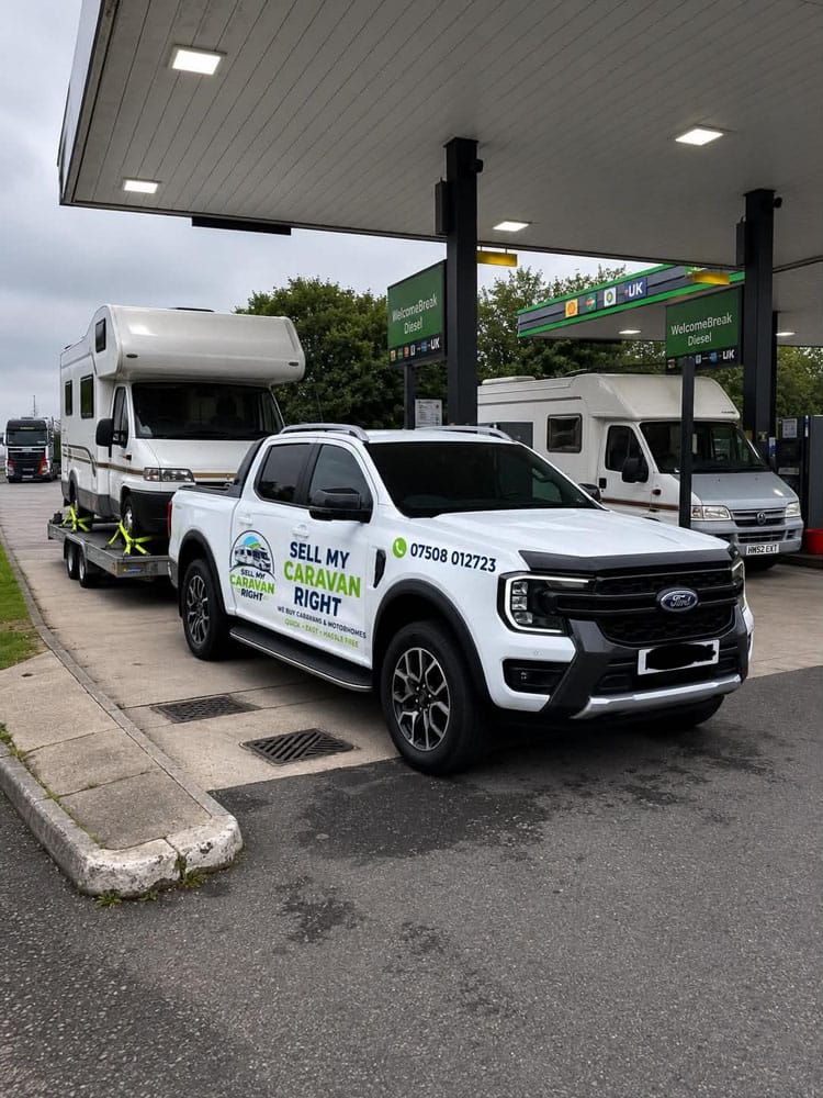 Sell My Caravan Right branded Ford Ranger collecting a motorhome on a transporter trailer